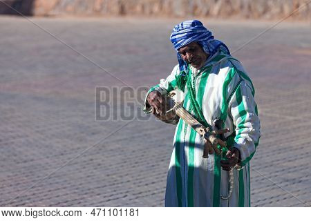 Ouarzazate, Morocco - January 30 2019: Berber Playing With A Loutar Or Lotar, A Plucked Berber Instr
