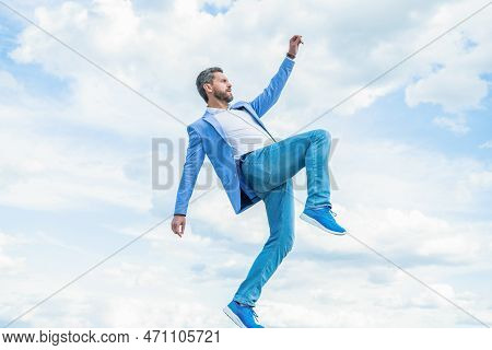 Carefree Successful Businessman Hurry Outside. Successful Businessman Hurry On Sky Background.
