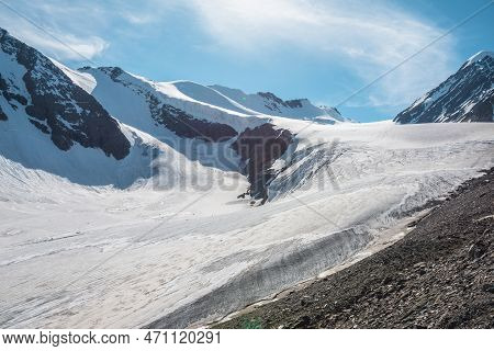 Scenic Mountain Landscape With Large Glacier In Sunlight. Awesome Snowy Scenery With Glacial Tongue 