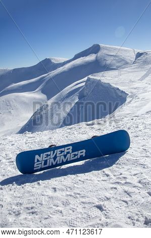 23 Feb 2022: Drahobrat, Ukraine - Freeride Snowboarding In The Snowy Mountains Among Rocks With Neve