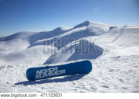 23 Feb 2022: Drahobrat, Ukraine - Freeride Snowboarding In The Snowy Mountains Among Rocks With Neve