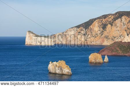 Rocky Cliffs On The Sea Coast. Sardinia, Italy. Nature Background