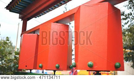 Rotation Of The Red Prayer Drums Outside The Buddhist Temple.