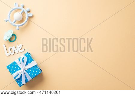Baby Accessories Concept. Top View Photo Of Blue Giftbox With Ribbon Bow Inscription Love Pacifier A