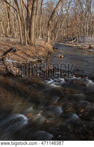 Hammel Creek Flows Through A Winter Forest With Expectation For The First Sifns Of Spring In Just A 