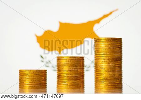 Money Coins Stacks In Front Of Cyprus Flag. Development Of Economy Of Cyprus Concept