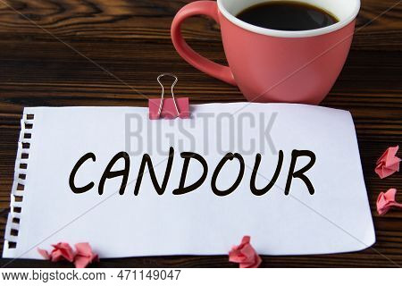 Candour - Word On A White Sheet On A Wooden Brown Background With A Cup Of Coffee And A Pen. Educati
