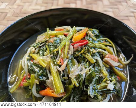 Stir Fried Water Spinach On Black Bowl, Cah Kangkung Or Tumis Kangkung, Indonesian Traditional Food