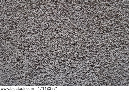 Close Shot Of Dusty Wall With Coarse Light Gray Roughcast Finish