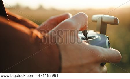 Hand Of A Man Pilot The Sport Fpv Drone With Remote Controller.