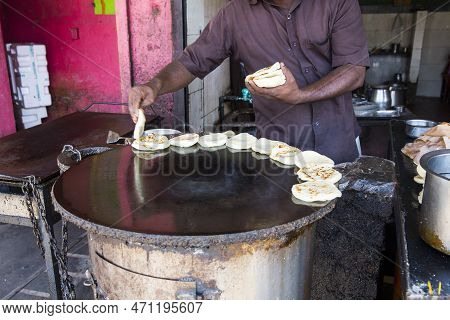 Pondicherry, India - December 2019, Circa. Unidentified Man In Restaurant Doing Parotta Bread For Lu