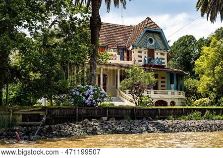 Boat Tour On The Parana Delta, Tigre, Buenos Aires, Argentina. Lush Vegetation, Palm Trees, Construc