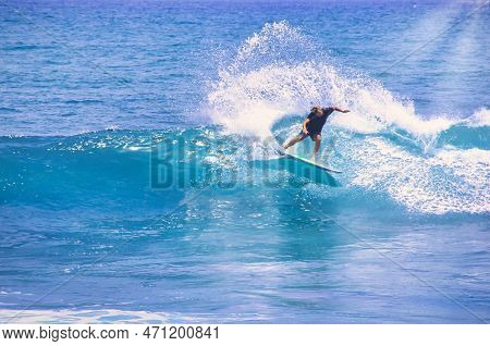 Hossegor, France - February Circa , 2019. An Unidentified Surfer Man Catching Riding On An Ocean Wav