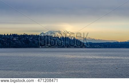 Clouds Cover Mount Rainier Across The Puget Soud In Washington State.