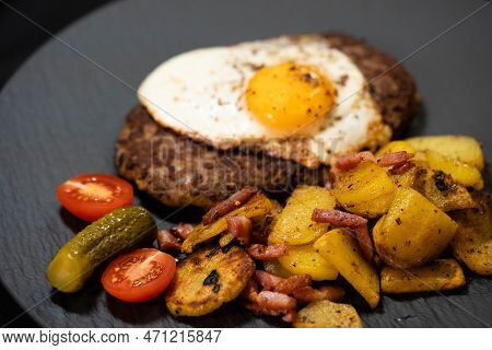 Hacksteak A La Meier Beefsteak With  Fried Eggs And Roasted Potatoes