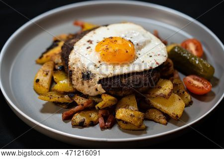 Hacksteak A La Meier Beefsteak With  Fried Eggs And Roasted Potatoes