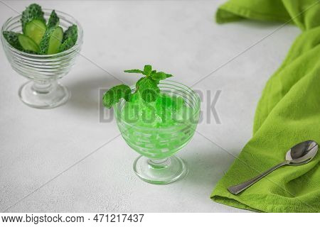 Summer Sicilian Dessert Granita, Frozen Juice Of Fresh Cucumber And Mint On A White Background. Summ