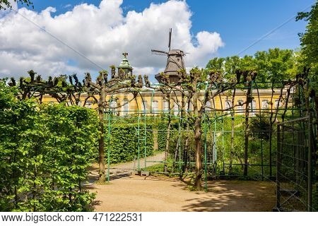 New Chambers (neue Kammern) Palace And Windmill (windmuhle) In  Sanssouci Park In Spring, Potsdam, G