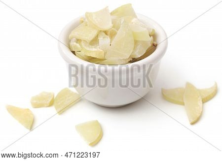 Sliced Amla Fruits In A Bowl Over White Background