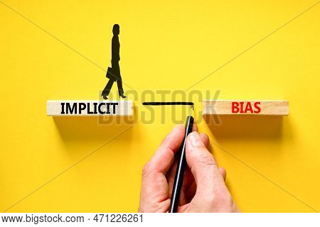 Implicit Bias Symbol. Concept Words Implicit Bias On Wooden Block. Beautiful Yellow Table Yellow Bac