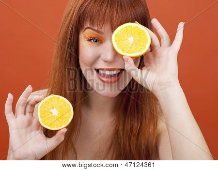 Redhead Girl With Orange