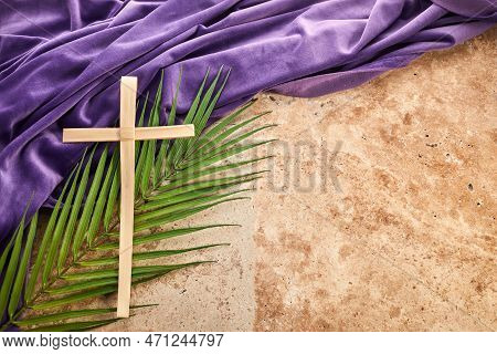 Lent Season, Holy Week And Good Friday Concept. Palm Leave And Cross On Stone Background