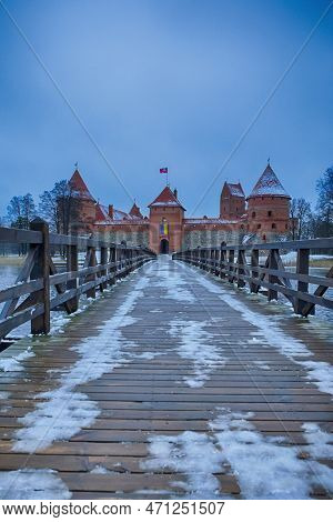 Lithuanian Travel Ideas. Trakai Medieval Castle With Towers Of Red Bricks And Wooden Connecting Brid