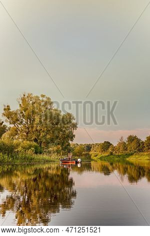 Trakai Medieval Castle With Towers Of Red Bricks And Wooden Connecting Bridge Over Galve Lake In Lit