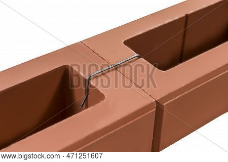 Constructions Ideas. Pair Of New Samples Bricks For Wall Building Bound With Metal Brace Isolated