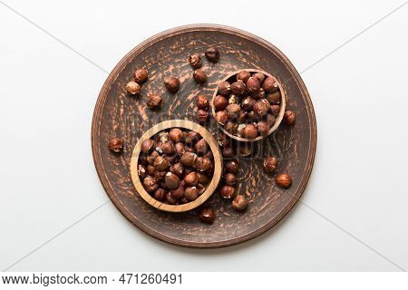 Wooden Bowl Full Of Hazelnuts On Table Background. Healthy Eating Concept. Super Foods.