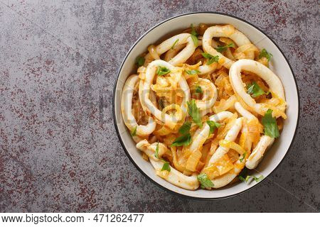Calamares Encebollados Calamari Rings With Caramelized Onions In Wine Sauce Close-up In A Bowl On Th