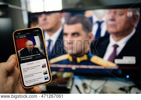 Paris, France - Feb 21, 2023: Man Reading Lenta.ru Watching On Pc Krym 24 Station Direct Stream As R