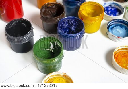 Bonks With Watercolor Paint. Paints For Artists .watercolor Paints Of Different Colors On A White Ba