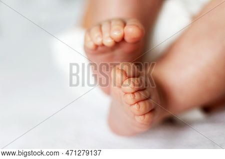 Baby Feet Close Up On White Background
