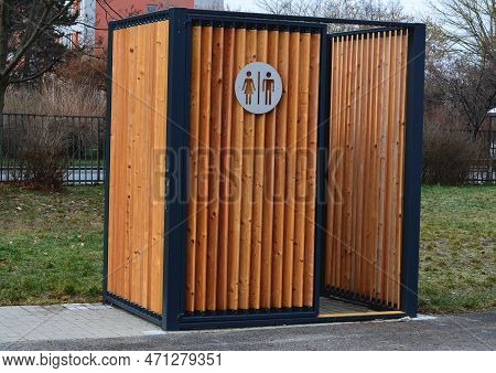 Closing Cage For Placing Chemical Toilets. Unsightly Plastic Boxes Are Inside Metal House With Flat 