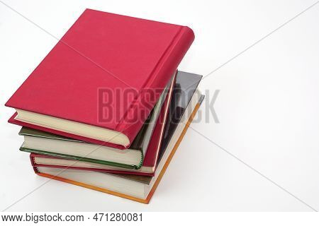 Stack Of Books On White Background. Knowledge And Education Concept.