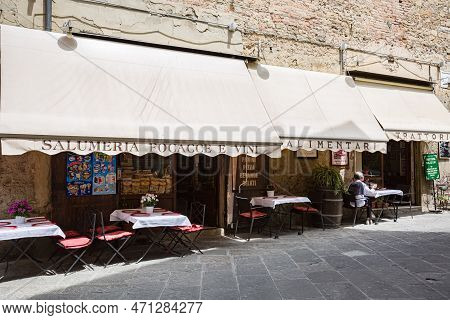 Tuscany, Arezzo – May, 2022: Cityscape. Small Street Cafe 