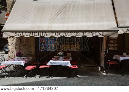 Tuscany, Arezzo – May, 2022: Cityscape. Small Street Cafe 