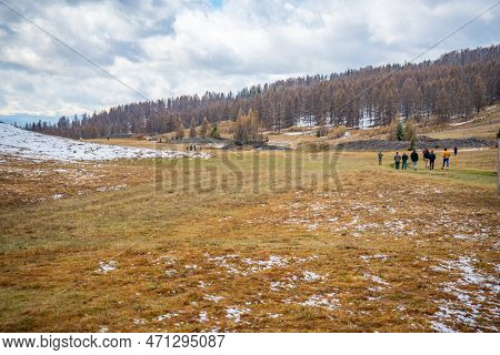 People On Historic Kurgan Or Tumulus, Grave Mound In Tschuja Steppes, Altai Republic, Siberia, Russi