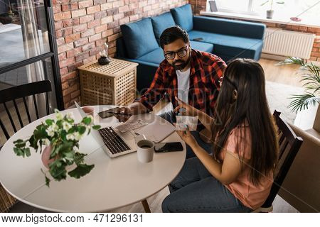 Serious Wife And Husband Planning Budget, Checking Finances, Focused Young Woman Using Online Calcul