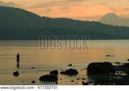Amazing Colorful Sunset Of Golden Hour A Man Stand Alone.