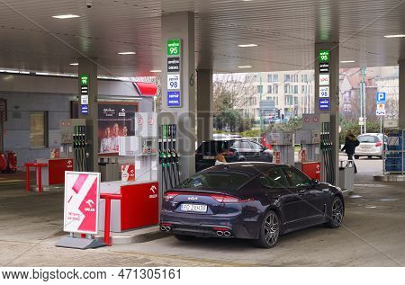 Poznan, Poland - February 11, 2023: Refueling Cars At A Gas Station In The City.