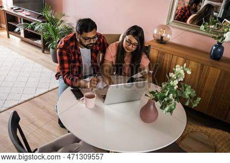 Serious Wife And Husband Planning Budget, Checking Finances, Focused Young Woman Using Online Calcul