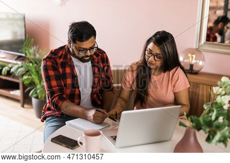 Serious Wife And Husband Planning Budget, Checking Finances, Focused Young Woman Using Online Calcul