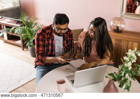 Serious Wife And Husband Planning Budget, Checking Finances, Focused Young Woman Using Online Calcul