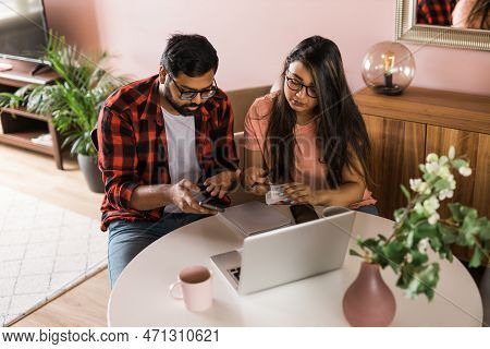 Serious Wife And Husband Planning Budget, Checking Finances, Focused Young Woman Using Online Calcul