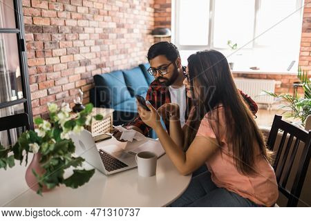 Serious Wife And Husband Planning Budget, Checking Finances, Focused Young Woman Using Online Calcul