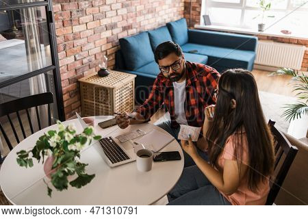 Serious Wife And Husband Planning Budget, Checking Finances, Focused Young Woman Using Online Calcul