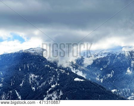 Beautiful Low Winter Clouds And Fog Condensation In The Swiss Alps Above The Tourist Resorts Of Valb