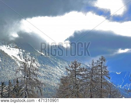 Beautiful Low Winter Clouds And Fog Condensation In The Swiss Alps Above The Tourist Resorts Of Valb